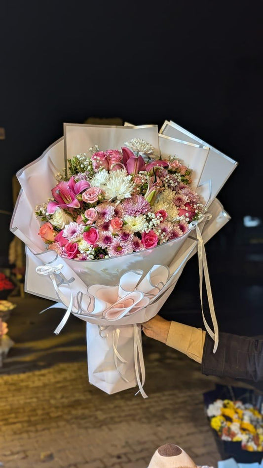 Lillies, Roses, Chrysanthemum and Babe Breath Bouquet.